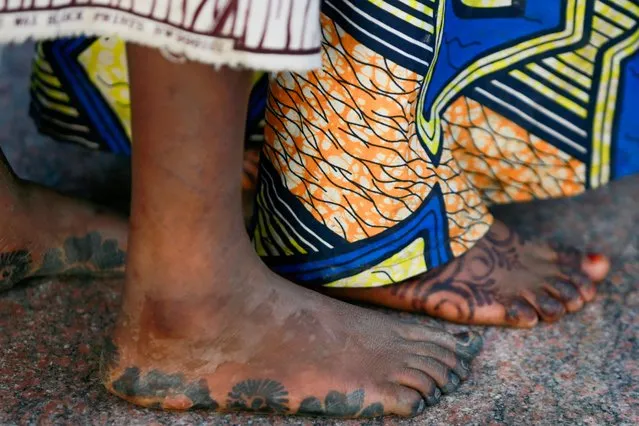 The feet of girls who were kidnapped from a boarding school in the northwest Nigerian state of Zamfara are seen after their release in Zamfara, Nigeria, March 2, 2021. (Photo by Afolabi Sotunde/Reuters)