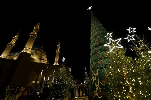 A Christmas tree designed by Lebanese designer Elie Saab is seen in front of al Amin mosque in Beirut, Lebanon, December 12, 2015. (Photo by Jamal Saidi/Reuters)