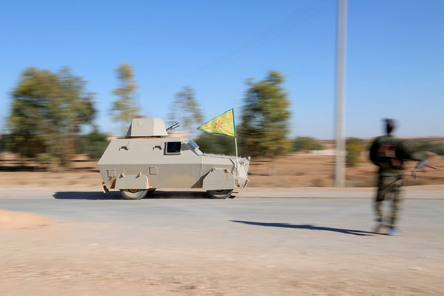 A Syrian Democratic Forces (SDF) military vehicle drives in Tal Samin village, north of Raqqa city, Syria November 19, 2016. (Photo by Rodi Said/Reuters)