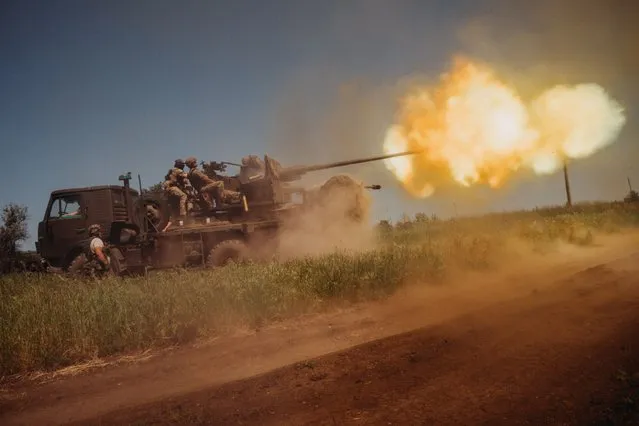 Ukrainian soldiers from the 60th Battalion of Territorial Defense, are shooting rounds into Russian positions with an S60 anti-aircraft canon placed on a truck, outside Bakhmut, Ukraine on June 19, 2023. (Photo by Wojciech Grzedzinski/Anadolu Agency via Getty Images)