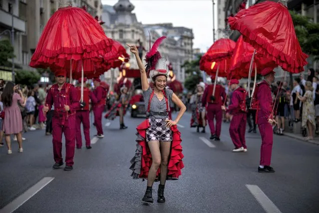 Artists of the French 20' Street Ballet perform during the B-FIT in the Street international festival in Bucharest, Romania, Sunday, July 2, 2023. The street theater festival took place over the weekend in the Romanian capital. (Photo by Vadim Ghirda/AP Photo)