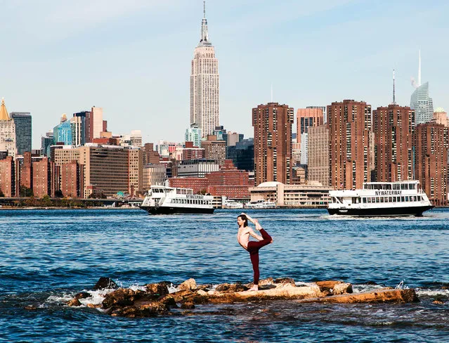 Yoga in front of the Empire State Building, New York. (Photo by Kristina Kashtanova/Caters News)