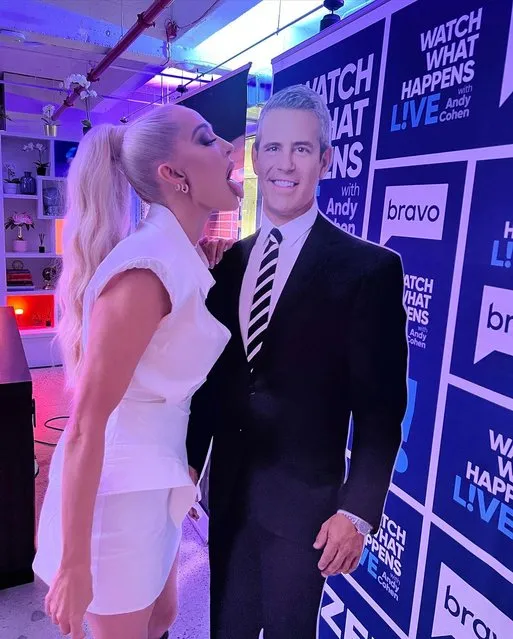 American singer Erika Jayne gives some tongue action to an American television presenter Andy Cohen cardboard cutout in the last decade of July 2023. (Photo by theprettymess/Instagram)