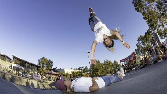 Mia Peterson, 16, from California, lays claim to a world record in August 2023 – “most people barani flipped over from a quarter pipe on rollerskates” – with the help of 12 brave friends. She has been named one of Guinness World Records’ young achievers and will be included in next year’s book. A barani flip is an aerial manoeuvre consisting of a front flip and a 180-degree turn, or half twist. (Photo by Guinness World Records)