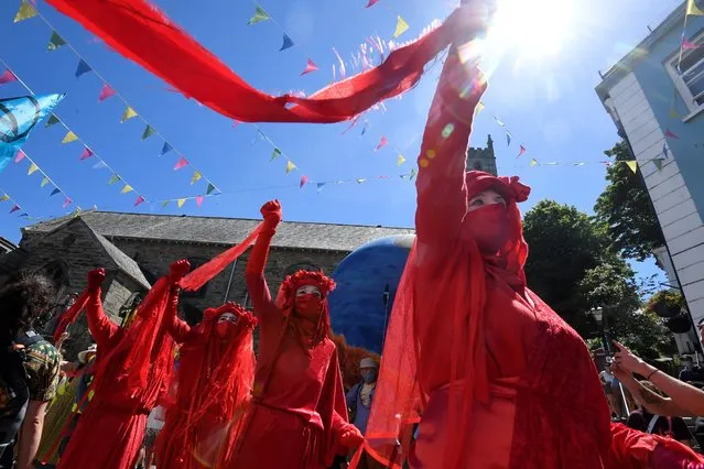 The Red Brigade activists attend an Extinction Rebellion demonstration in Falmouth, during the G7 summit in Cornwall, Britain, June 12, 2021. (Photo by Toby Melville/Reuters)