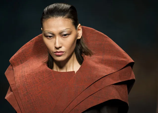 A model presents a creation from the Merisis Li Na collection during a fashion show as part of China Fashion Week in Beijing, Thursday, March 26, 2015. (Photo by Mark Schiefelbein/AP Photo)
