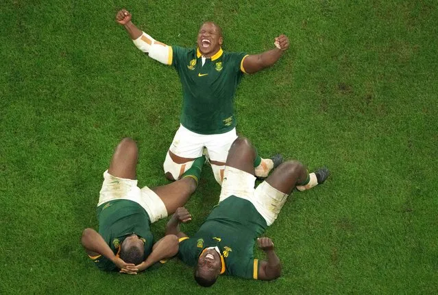 South Africa's hooker Bongi Mbonambi (C) celebrates with teammates South Africa's prop Ox Nche (L) and South Africa's prop Trevor Nyakane (R) after victory in the France 2023 Rugby World Cup Final between New Zealand and South Africa at the Stade de France in Saint-Denis, on the outskirts of Paris, on October 28, 2023. (Photo by Antonin Thuillier/AFP Photo)