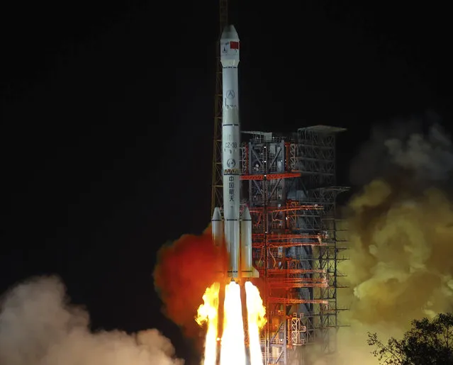 In this photo released by Xinhua News Agency, the Chang'e 4 lunar probe launches from the the Xichang Satellite Launch Center in southwest China's Sichuan Province, Saturday, December 8, 2018. China launched a ground-breaking mission Saturday to soft-land a spacecraft on the largely unexplored far side of the moon, demonstrating its growing ambitions as a space power to rival Russia, the European Union and U.S. (Photo by Jiang Hongjing/Xinhua News Agency via AP Photo)