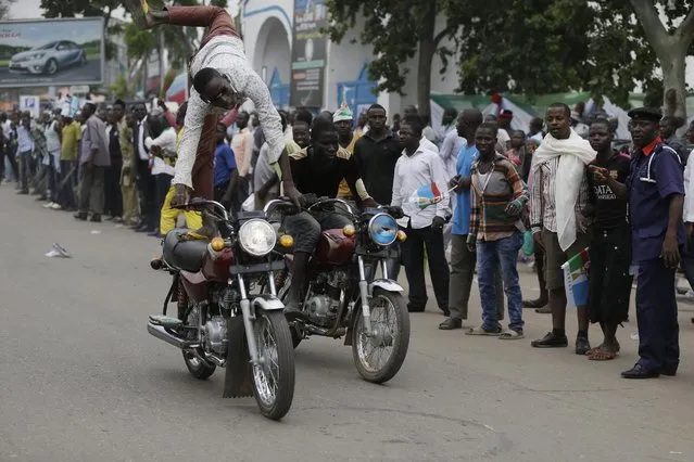 Supporters of President Elect, Gen. Muhammadu Buhari, celebrate his victory in Abuja, Nigeria, Wednesday, April 1, 2015. Nigerian President Goodluck Jonathan conceded defeat to Buhari, a 72-year-old former military dictator, who was elected in a historic transfer of power following the nation's most hotly contested election ever. (Photo by Sunday Alamba/AP Photo)