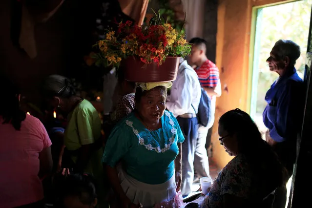 Catholic faithful prepare to participate on a procession during the “Fiesta de las Palancas” celebration to ask for blessings and abundance during the new year in Panchimalco, El Salvador, January 5, 2017. (Photo by Jose Cabezas/Reuters)