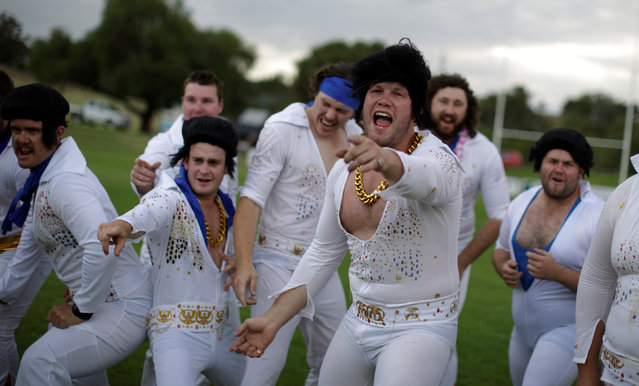 Amateur rugby players from the 'Blue Suede Shoes' team, dressed in Elvis Presley suits, perform a haka prior to their rugby union game against the Reddy Teddies during the 25th annual Parkes Elvis Festival in the rural Australian town of Parkes, west of Sydney, Australia January 13, 2017. (Photo by Jason Reed/Reuters)