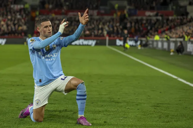 Manchester City's Phil Foden celebrates after scoring his side's second goal during the English Premier League soccer match between Brentford and Manchester City at the Gtech Community Stadium in London, Monday, February 5, 2024. (Photo by Ian Walton/AP Photo)