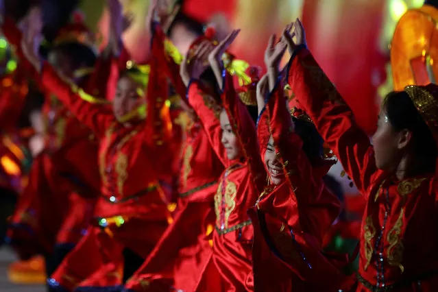 Dancers perform on stage during the Chinese New Year Celebrations 2014 Official Light-Up and Opening Ceremony in Chinatown on January 11, 2014 in Singapore. (Photo by Suhaimi Abdullah/Getty Images)