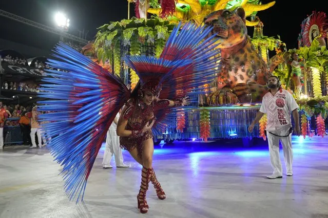 A performer from the Salgueiro samba school parades during Carnival celebrations at the Sambadrome in Rio de Janeiro, Brazil, early Monday, February 12, 2024. (Photo by Silvia Izquierdo/AP Photo)