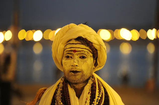 An Indian Sadhu (Hindu holy man) looks on as he walks on the banks of the Sangam during the Magh Mela festival in Allahabad on February 7, 2017. (Photo by Sanjay Kanojia/AFP Photo)