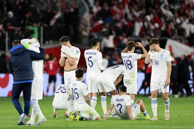 Greece's players react after losing the UEFA EURO 2024 qualifying play-off final football match between Georgia and Greece in Tbilisi on March 26, 2024. (Photo by Giorgi Arjevanidze/AFP Photo)