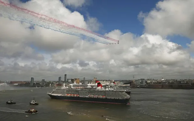 The Red Arrows, the British Royal Air Force Aerobatic Team, fly over Cunard liners Queen Mary 2, Queen Victoria and Queen Elizabeth on the River Mersey in Liverpool, Britain May 25, 2015. (Photo by Phil Noble/Reuters)