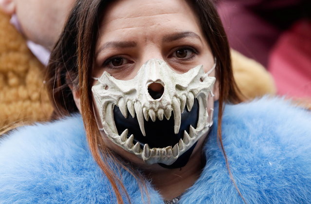 A demonstrator wears a mask during a protest against the Czech government's restrictions, as the spread of the coronavirus disease (COVID-19) continues, at the Old Town Square in Prague, Czech Republic on January 10, 2021. (Photo by David W. Cerny/Reuters)