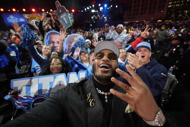 Alabama offensive lineman JC Latham celebrates with fans after being chosen by the Tennessee Titans with the seventh overall pick during the first round of the NFL football draft, Thursday, April 25, 2024, in Detroit. (Photo by Paul Sancya/AP Photo)