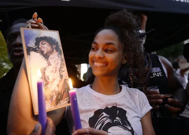 Julya Baer, 30, attends  a candlelight vigil and celebration of Prince's life in Leimert Park in memory of musician Prince on April 21, 2016, in Los Angeles, California. Prince died earlier today at his Paisley Park compound at the age of 57. (Photo by Kevork Djansezian/Getty Images)