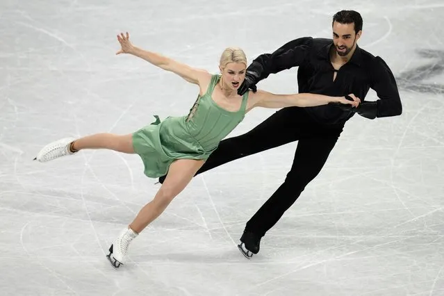 Olivia Smart and Adrian Diaz, of Spain, perform their routine in the ice dance competition during the figure skating at the 2022 Winter Olympics, Monday, February 14, 2022, in Beijing. (Photo by Natacha Pisarenko/AP Photo)