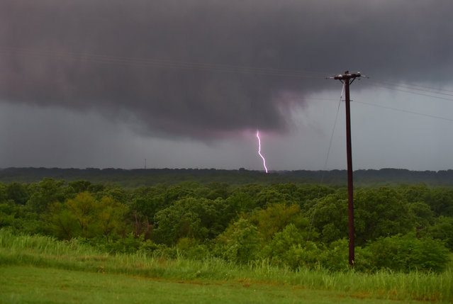 Lightning strikes as storm clouds pass in Denton, Texas, Sunday, May 10, 2015. (Photo by Al Key/The Denton Record-Chronicle via AP Photo)