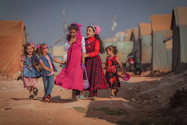 Syrian children are seen at a camp during Eid al-Adha in Idlib, Syria on July 20, 2021. Syrians were forced leave their homes due to Assad regime's attacks. (Photo by Muhammed Said/Anadolu Agency via Getty Images)