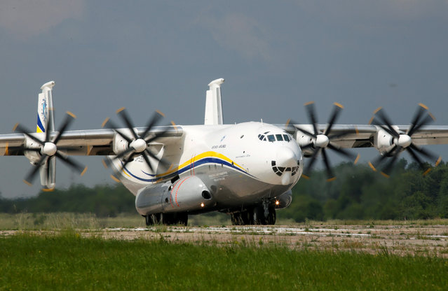 An Antonov An-22A “Antei” (Antheus), believed to be the world's largest turboprop powered aircraft, drives along the tarmac of the Antonov aircraft plant before the first demonstration flight after the plane's renovation in Kiev, Ukraine, May 30, 2016. (Photo by Valentyn Ogirenko/Reuters)