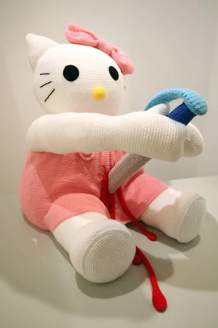 The knitted sculpture 'Hello Kitty' by Patricia Waller, featuring the cartoon character as a harakiri ritual suicide victim, sits in the 'Broken Heroes' exhibition at the Deschler Gallery