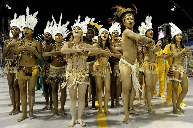 Revellers of the Unidos do Peruche samba school sing and dance at the Sambadrome in Sao Paulo, Brazil