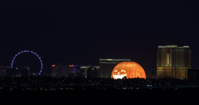 The High Roller at The Linq Promenade, Harrah's Las Vegas, The Venetian Resort Las Vegas, Sphere, lit up as a jack-o'-lantern, and The Palazzo at The Venetian Resort Las Vegas are shown on the Las Vegas Strip on October 14, 2024 in Las Vegas, Nevada. (Photo by Ethan Miller/Getty Images)