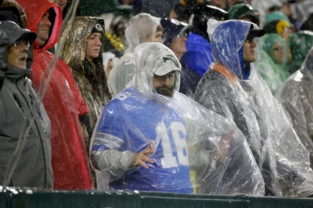 Rain comes down on fans during the second half of an NFL football game between the Green Bay Packers and the Detroit Lions, Sunday, November 3, 2024, in Green Bay, Wis. (Photo by Mike Roemer/AP Photo)