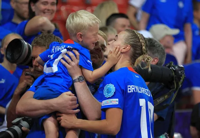 Iceland's midfielder Dagny Brynjarsdottir hugs relatives at the end of the UEFA Women's Euro 2022 Group D football match between Iceland and France at New York Stadium in Rotherham, northern England on July 18, 2022. No use as moving pictures or quasi-video streaming. Photos must therefore be posted with an interval of at least 20 seconds. (Photo by Lee Smith/Reuters)