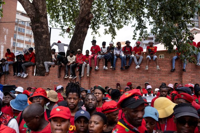 Members of the Economic Freedom Fighters (EFF) gather outside the Constitutional Court, where the political party is challenging the National Assembly’s rejection of a report that could have led to impeachment proceedings against President Cyril Ramaphosa due to the Phala Phala scandal at his private game farm in Johannesburg, South Africa on November 26, 2024. (Photo by Ihsaan Haffejee/Reuters)