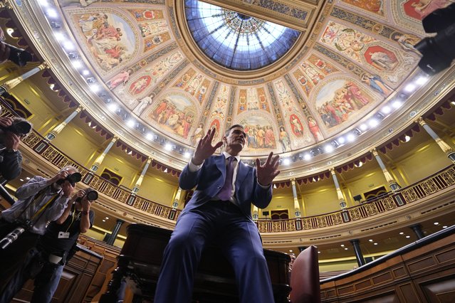 Spain's acting Prime Minister Pedro Sanchez poses for photographers after he was chosen by a majority of legislators to form a new government after a parliamentary vote at the Spanish Parliament in Madrid, Spain, Thursday, November 16, 2023. (Photo by Manu Fernandez/AP Photo)