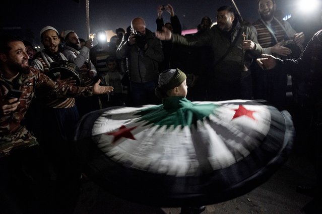 People forced to flee from Ghouta to Idlib in 2018, arrive in Damascus, Syria, 08 January 2025, after opposition forces toppled president Bashar al-Assad. A group of internally displaced people from eastern Ghouta and rural Damascus, who were forced to leave their homes to Idlib in 2018, returned amid celebrations at Umayyad Square in Damascus on 08 January. (Phoot by Hasan Belal/EPA)