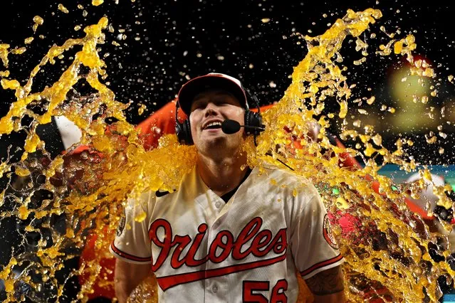 Starting pitcher Kyle Bradish #56 of the Baltimore Orioles is doused with Gatorade after defeating the Houston Astros at Oriole Park at Camden Yards on September 22, 2022 in Baltimore, Maryland. (Photo by Patrick Smith/Getty Images)