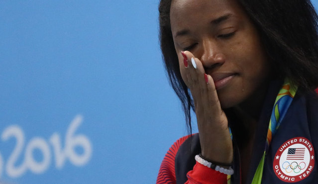 2016 Rio Olympics, Swimming, Victory Ceremony, Women's 100m Freestyle Victory Ceremony, Olympic Aquatics Stadium, Rio de Janeiro, Brazil on August 11, 2016. Simone Manuel (USA) of USA cries. (Photo by Stefan Wermuth/Reuters)