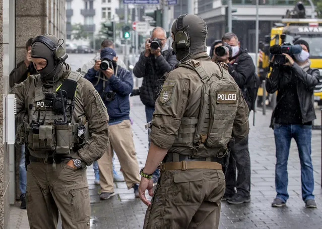 Special Police forces stand in front of the justice building, in Frankfurt, Germany, Tuesday, June 16, 2020. A German court will begin hearing the case against two far-right extremists accused of killing a regional politician. The execution-style slaying of Walter Luebcke shocked the country last year. Stephan E a 46-year-old with previous convictions for violent anti-migrant crimes, will appear in the Frankfurt regional court accused of murder, attempted murder, serious bodily harm and firearms offenses. A second man, identified only as Markus H. due to privacy rules, is charged with accessory to murder and breaking firearms laws. (Photo by Michael Probst/AP Photo)