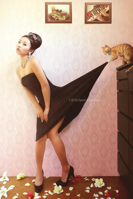 There's something s*xy about black dress and a cat. (Photo by Yuri Figuenick)