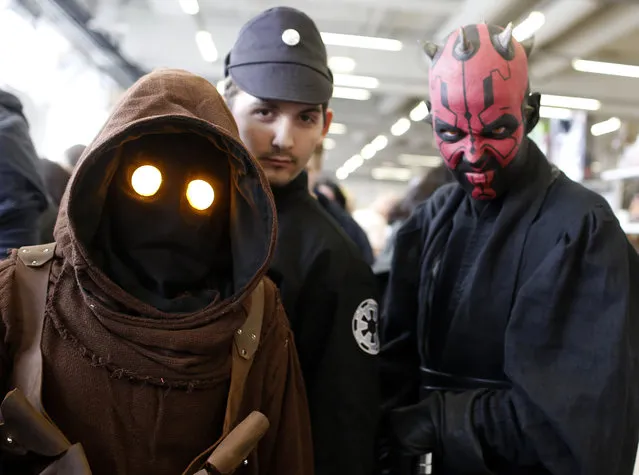 A group of people dressed as a Star Wars characters pose at the cartoon fair “Vienna Comix” in Vienna October 4, 2014. “Vienna Comix”, one of Europe's largest cartoon fairs, takes place twice a year and is expected to attract thousands of fans from Austria and the neighbouring countries. (Photo by Leonhard Foeger/Reuters)