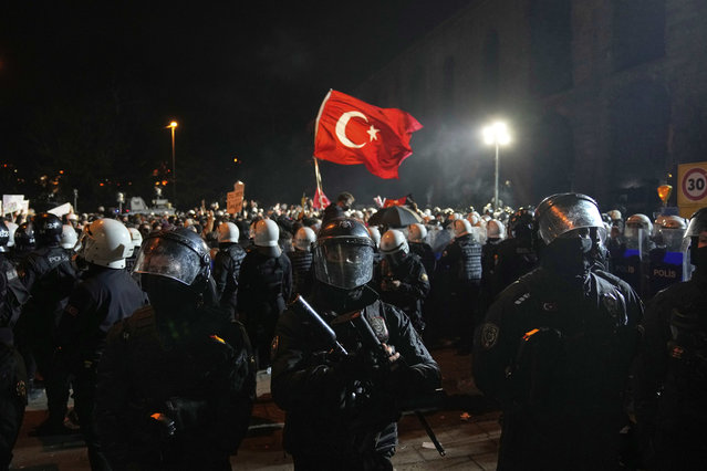 Anti riot police officers take positions during a protest after Istanbul's Mayor Ekrem Imamoglu was arrested and sent to prison, in Istanbul, Turkey, Monday, March 24, 2025. (Photo by Khalil Hamra/AP Photo)