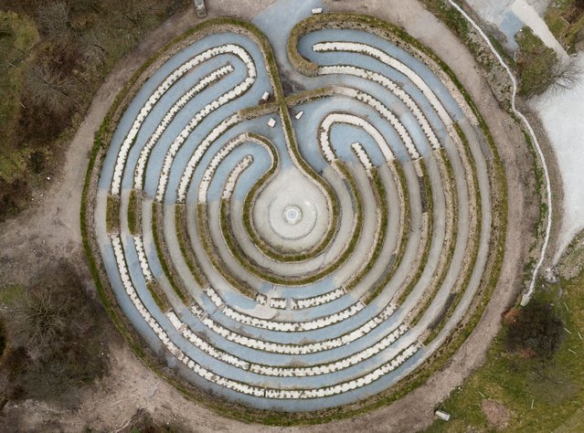 A general view of Kerdroya, a giant 56-metre-wide Cornish Landscape Labyrinth on Wednesday, March 19, 2025. The labyrinth, made from Cornish hedging is located at Colliford Lake, Bodmin Moor, UK. Visitors will walk along a 750-metre path through stonework that celebrates hedging styles from across Kernow, leading to a central circular space with The Heart of Kerdroya sculpture, and views across the moorland and lake. (Photo by Andrew Matthews/PA Wire)