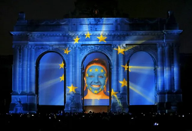 The video mapping "Sounds and Lights of Unity" is projected on the Arcades of Cinquantenaire to celebrate the 25th anniversary of German reunification, in Brussels, Belgium, October 1, 2015. (Photo by Francois Lenoir/Reuters)