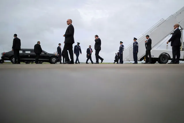 Staff and member of the secret service prepare for the arrival of U.S. President Donald Trump at Charlotte Douglas International Airport in Charlotte, North Carolina, U.S., August 24, 2020. (Photo by Carlos Barria/Reuters)