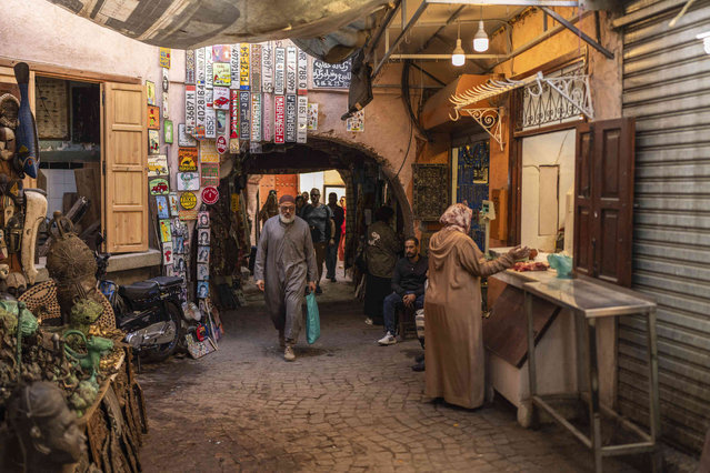 People walk as other shop in the old Medina of Marrakech, Morocco, Monday, November 18, 2024 (Photo by Mosa'ab Elshamy/AP Photo)