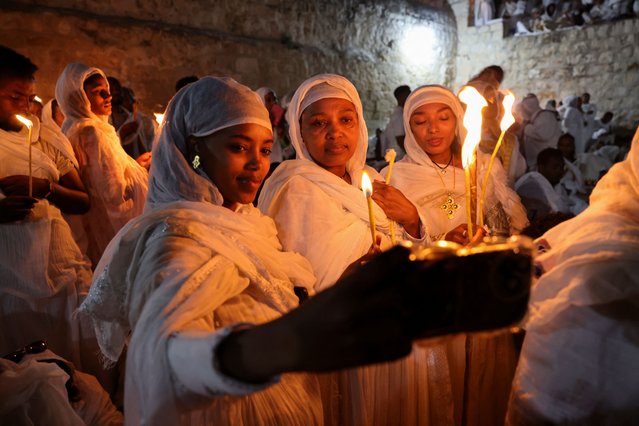 Women take a sellfie, as Ethiopian Orthodox faithful take part in the Holy Fire ceremony at the Ethiopian section of the Church of the Holy Sepulchre in Jerusalem's Old City, on April 19, 2025. (Photo by Jamal Awad/Reuters)