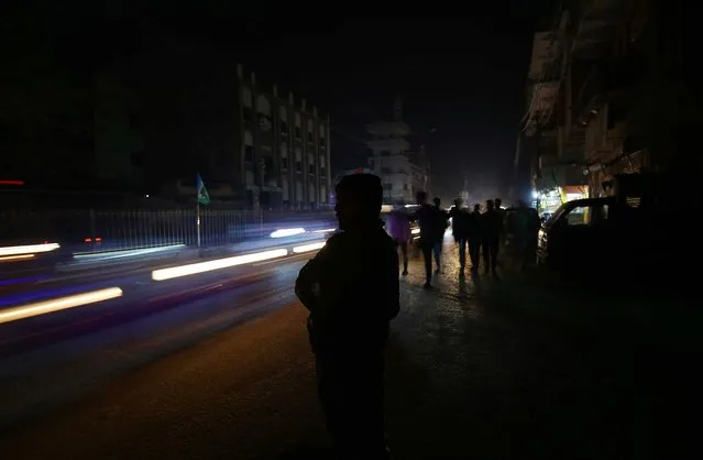 A local market without electricity as the country is plunged into darkness following a major power breakdown, in Karachi, Pakistan, 23 January 2023. According to the Ministr of Energy Khurram Dastgir, the system of frequency of the national grid went down resulting in a widespread breakdown in the system. Pakistan is facing a severe economic crisis that led the government to recently approve a new energy conservation plan to reduce consumption. The plan includes measures such as the early closure of markets and malls as well as restrictions on the purchase of certain low-efficiency energy products. (Photo by Shahzaib Akber/EPA/EFE)