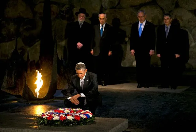 President Barack Obama pauses after laying a wreath at the Yad Vashem Holocaust memorial in Jerusalem, on March 22, 2013, accompanied by (from right) Avner Shalev, chairman of the Yad Vashem Directorate, Israeli Prime Minister Benjamin Netanyahu, Israeli President Shimon Peres and Rabbi Yisrael Meir Lau. (Photo by Doug Mills/The New York Times)