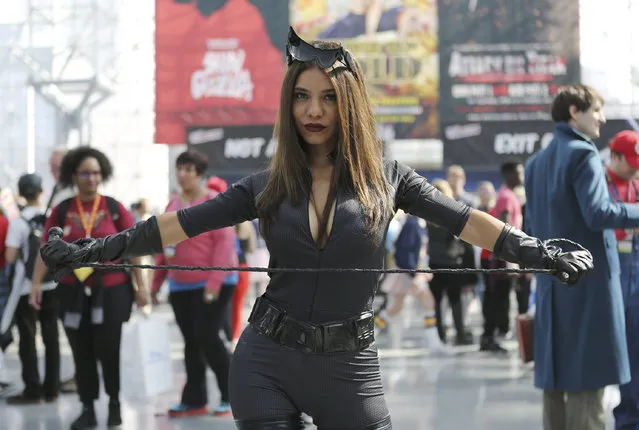 A fan dresses up in costume while attending the first day of New York Comic Con at the Javits Center on Thursday, October 6, 2016. (Photo by Steve Luciano/AP Photo)